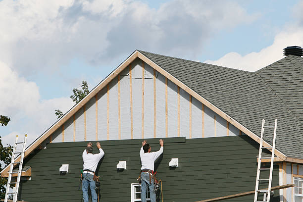 Professional Siding technician working in Belmont, MA